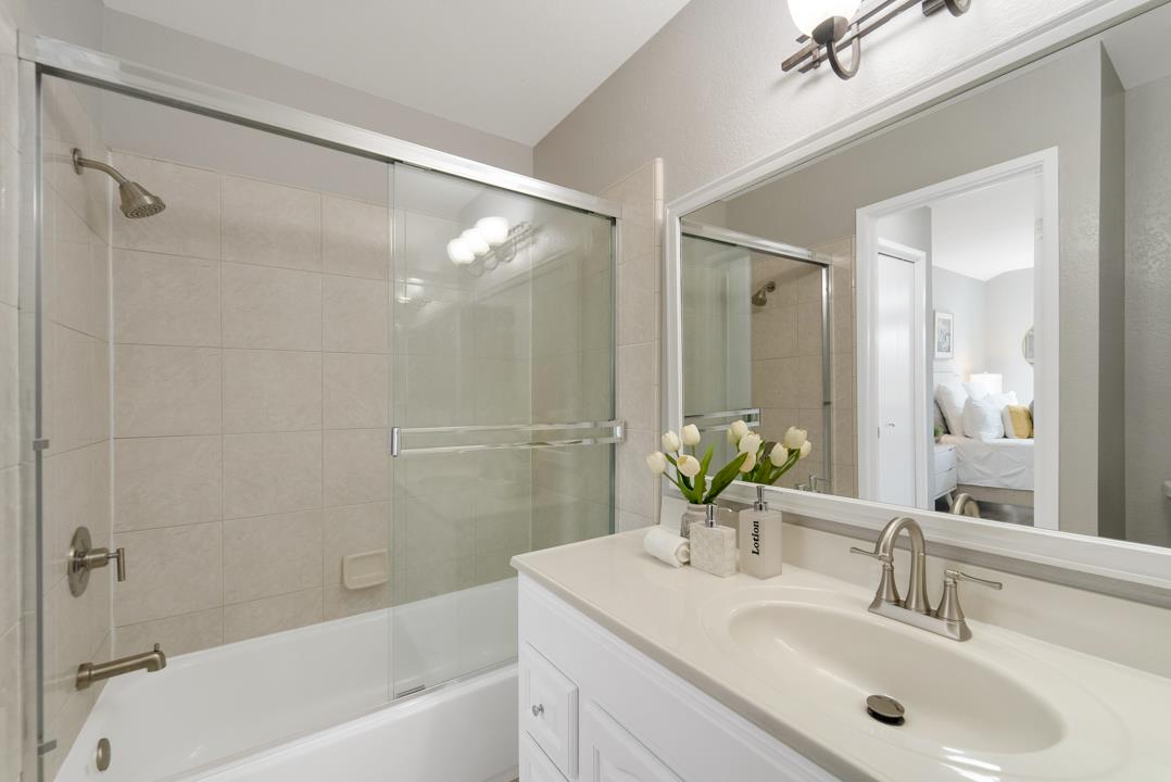 2865 South Bascom Avenue, Unit 902 San Jose, CA 95124 - Photo 20 of 29 a bathroom with a bathtub shower sink and a mirror