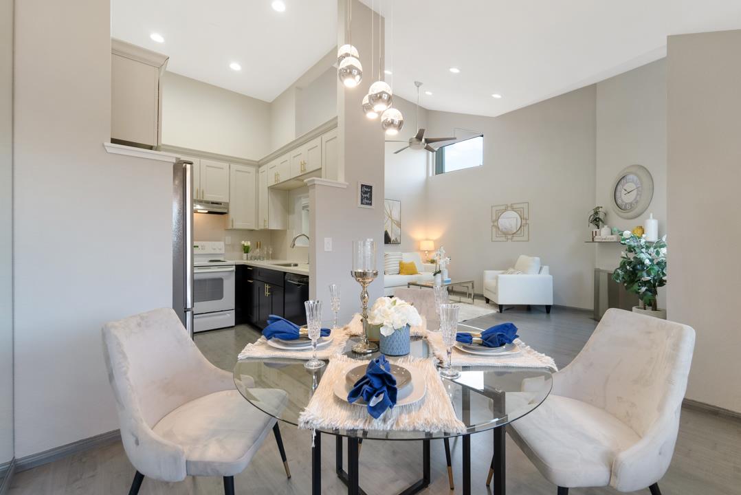 2865 South Bascom Avenue, Unit 902 San Jose, CA 95124 - Photo 8 of 29 a view of a dining room with furniture and a chandelier