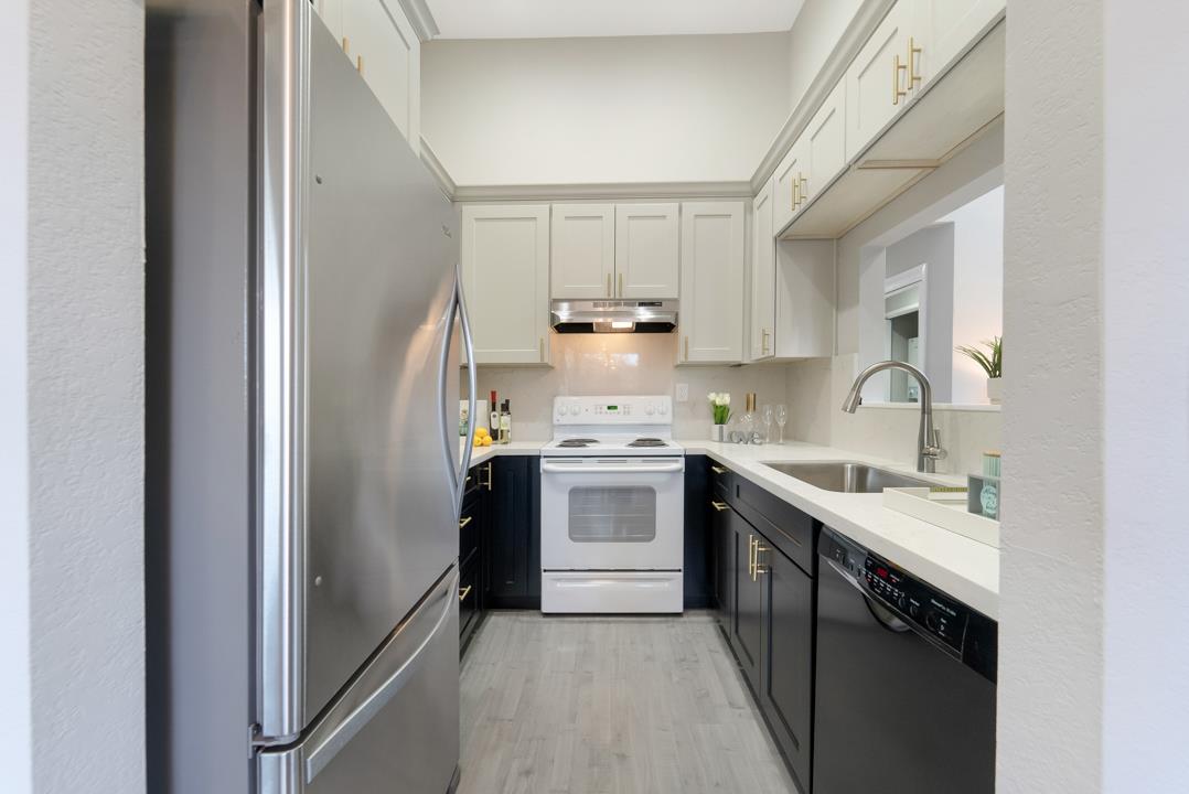 2865 South Bascom Avenue, Unit 902 San Jose, CA 95124 - Photo 9 of 29 a kitchen with a stove sink and cabinets