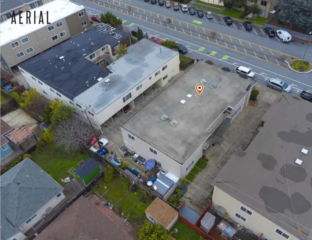 an aerial view of a house with a yard