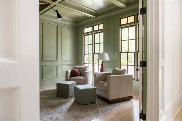 a view of a livingroom with furniture and wooden floor
