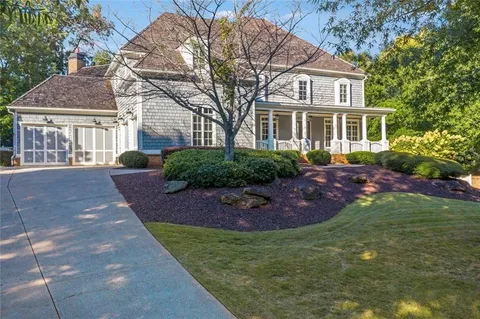 a view of a house with a garden