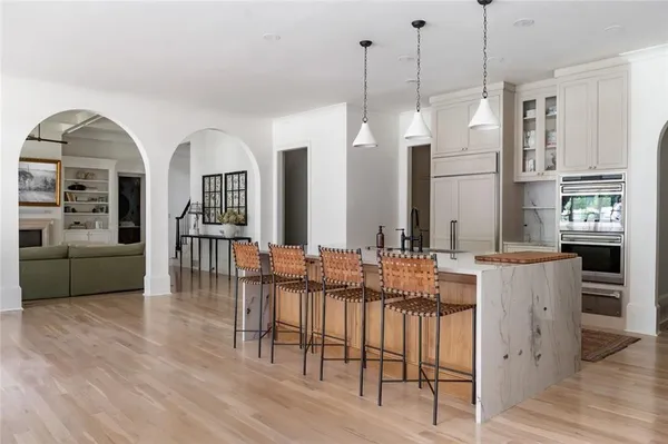 a living room with furniture fireplace and flat screen tv