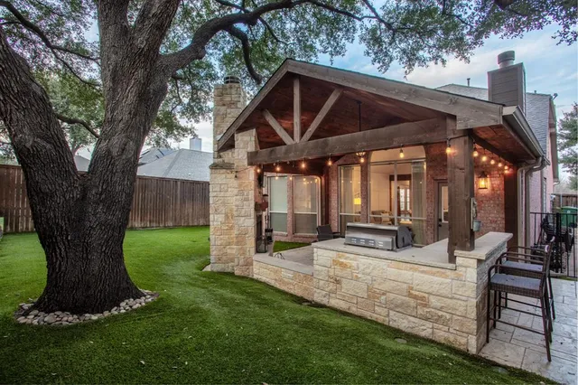 a outdoor living space with furniture and a fireplace