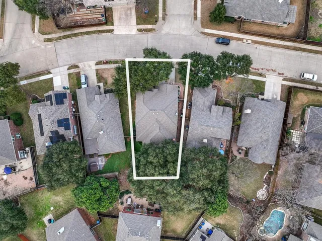 an aerial view of house with yard