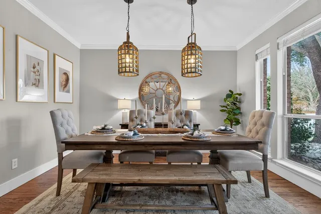a view of a dining room with furniture window and wooden floor