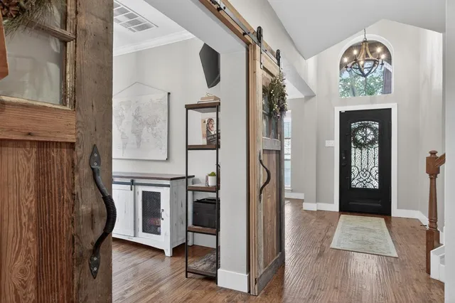 a view of entryway with wooden floor