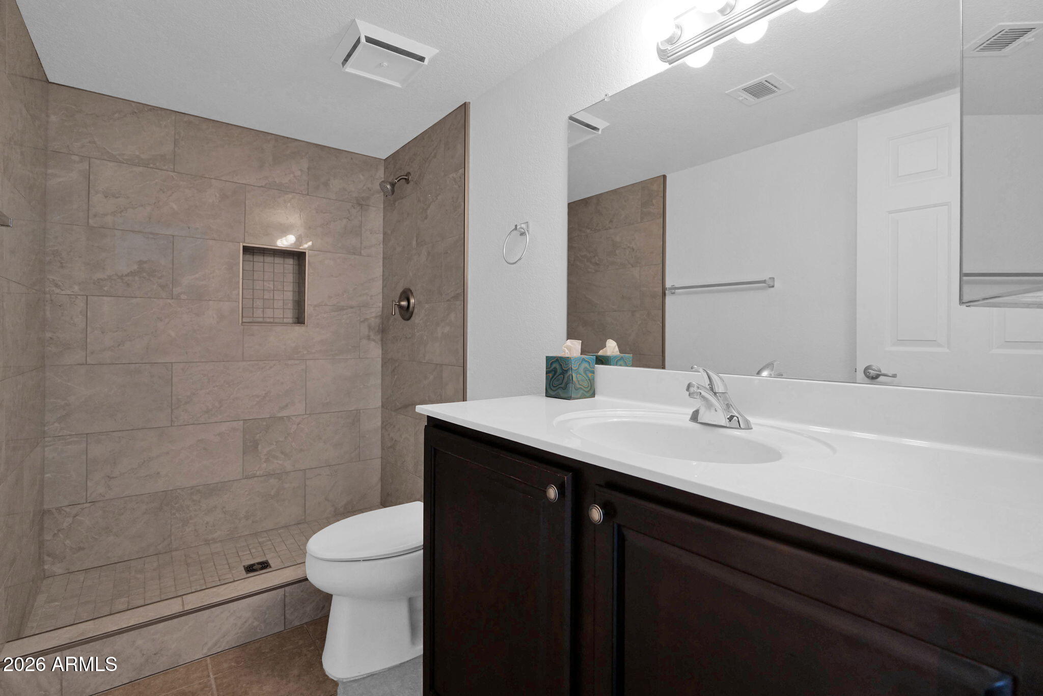1720 East Thunderbird Road, Unit 1019 Phoenix, AZ 85022 - Photo 4 of 47 a bathroom with a sink a toilet a shower and a mirror