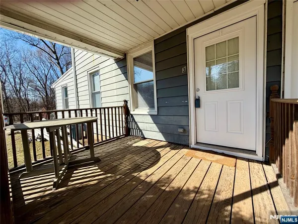 a view of outdoor space with deck and furniture