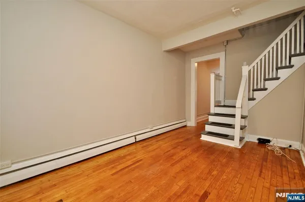 a view of an empty room with stairs