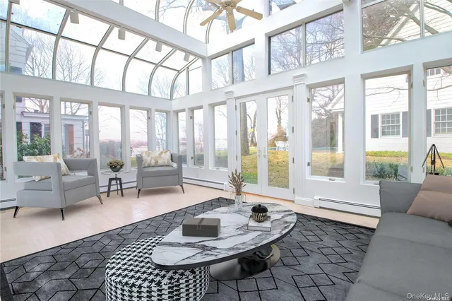 a living room with furniture rug and window