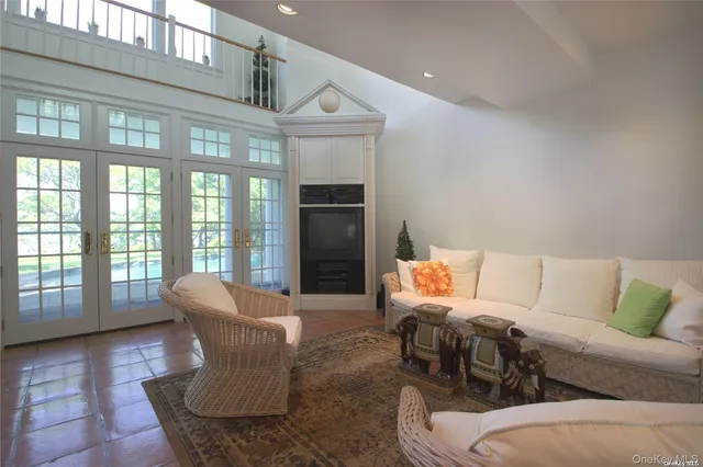 a view of a room with wooden floor and windows