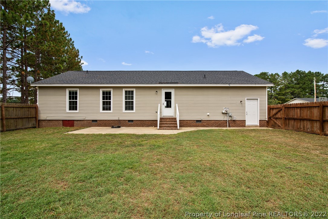 2064 Bainbridge Road Stedman, NC 28391 - Photo 39 of 43 a house view with a backyard space
