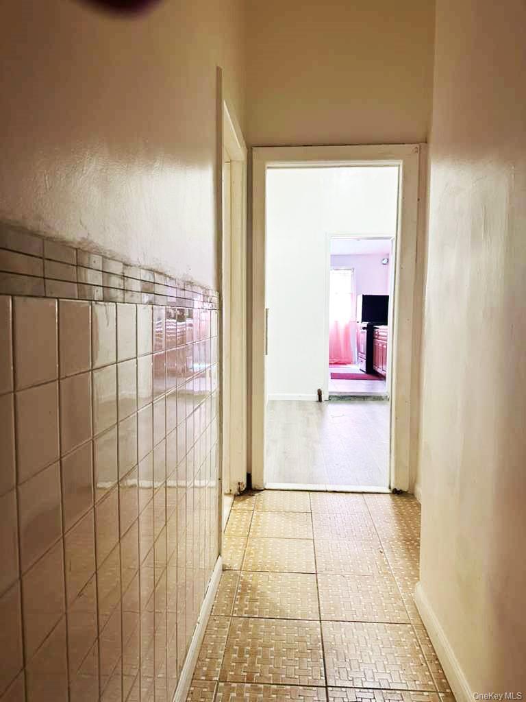 88-22 85th Street Queens, NY 11421 - Photo 16 of 39 a view of a bathroom with a shower
