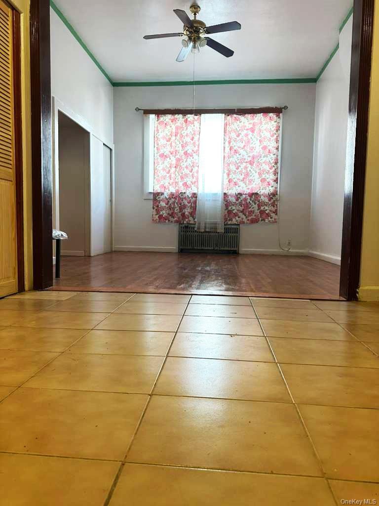 88-22 85th Street Queens, NY 11421 - Photo 21 of 39 a view of an empty room with a window