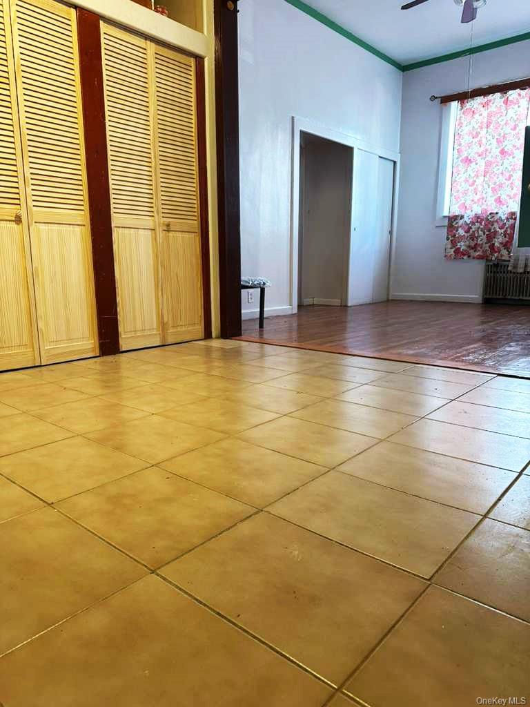 88-22 85th Street Queens, NY 11421 - Photo 23 of 39 a view of an empty room with a window