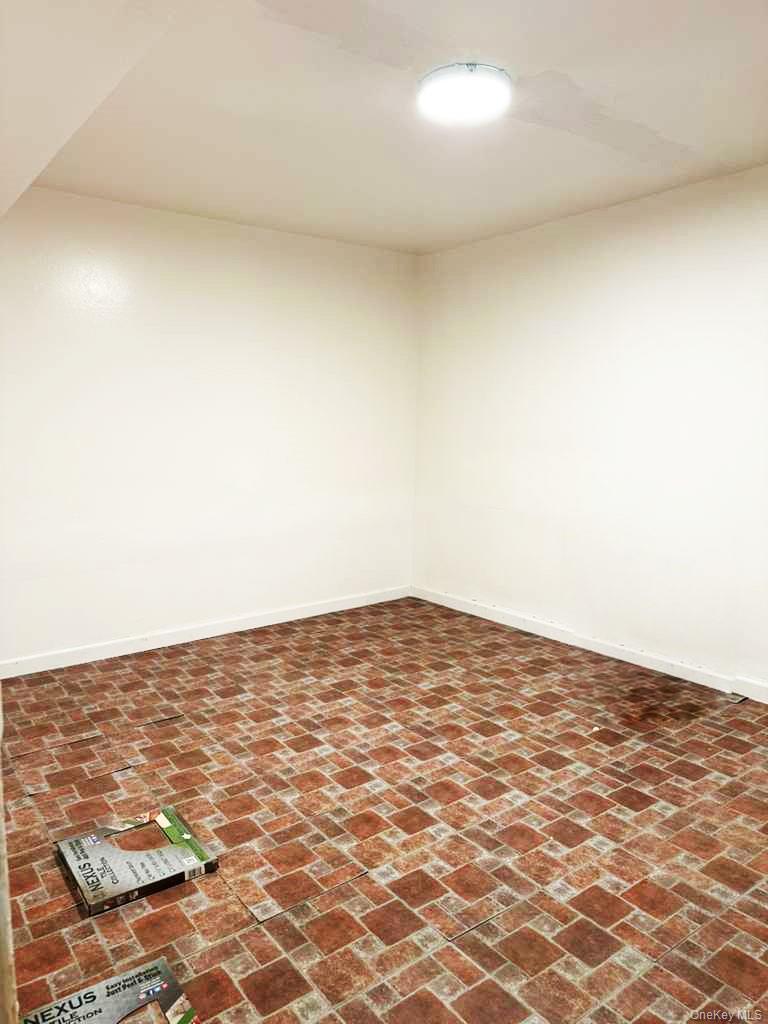88-22 85th Street Queens, NY 11421 - Photo 27 of 39 a view of empty room with wooden floor