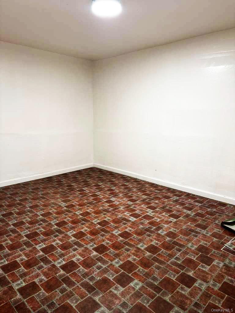 88-22 85th Street Queens, NY 11421 - Photo 30 of 39 an empty room with a natural light
