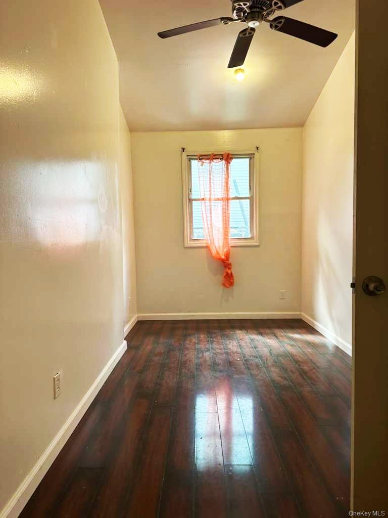 88-22 85th Street Queens, NY 11421 - Photo 36 of 39 a view of an empty room and a window