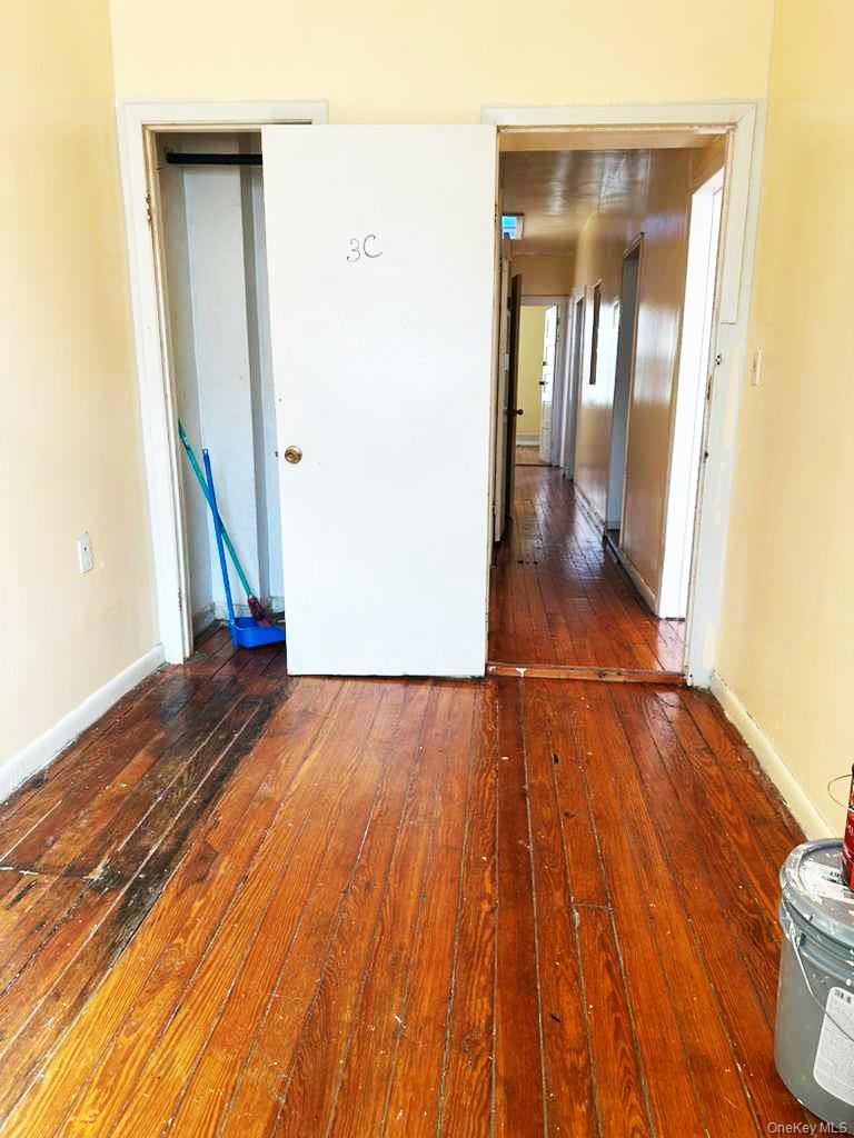 88-22 85th Street Queens, NY 11421 - Photo 6 of 39 a view of empty room with wooden floor