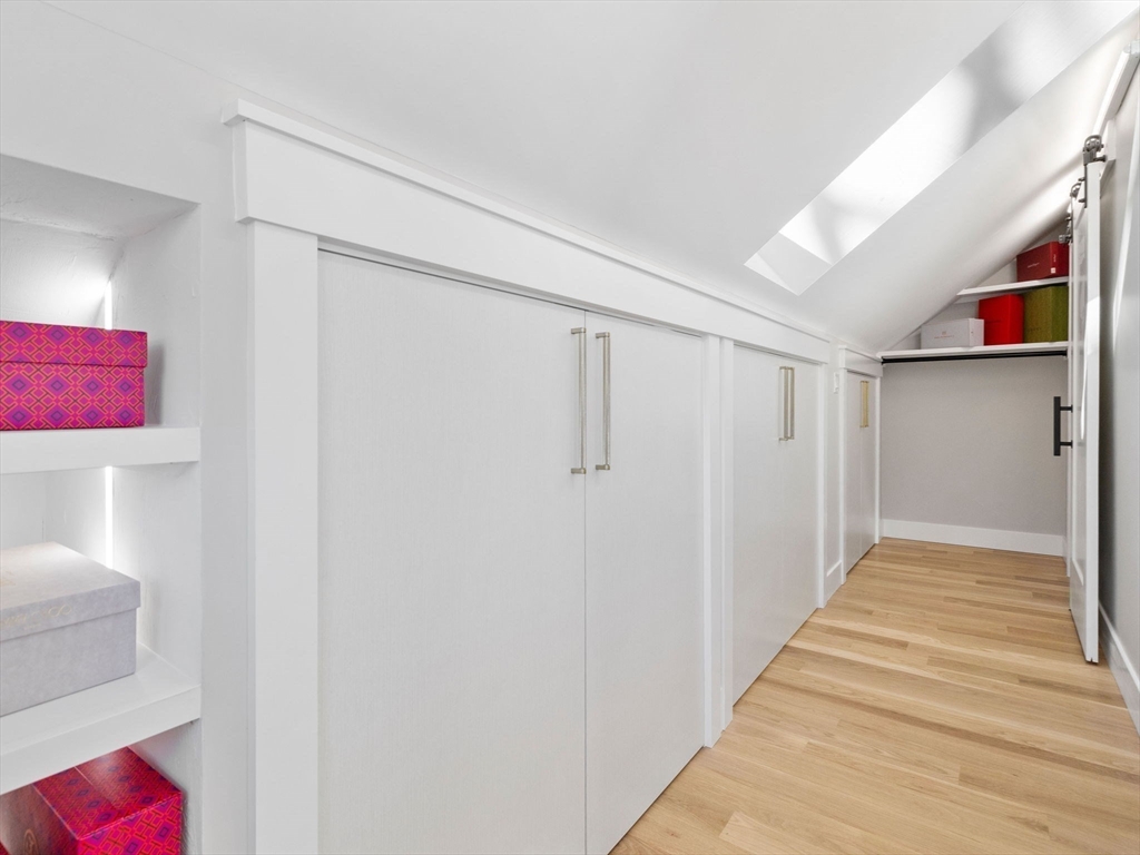 58 Townly Road Watertown, MA 02472 - Photo 20 of 42 a view of a hallway with wooden floor and closet