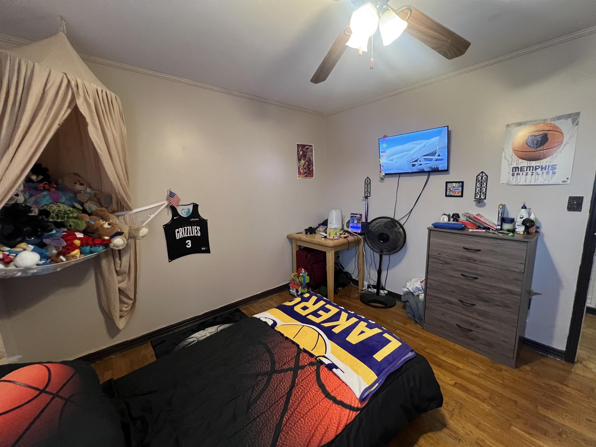 65 Walnut Street Savannah, TN 38372 - Photo 12 of 18 a bedroom with a bed and a bookshelf