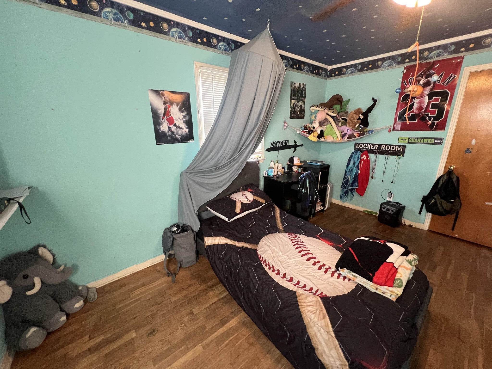 65 Walnut Street Savannah, TN 38372 - Photo 14 of 18 a bed room with a bed and a couch