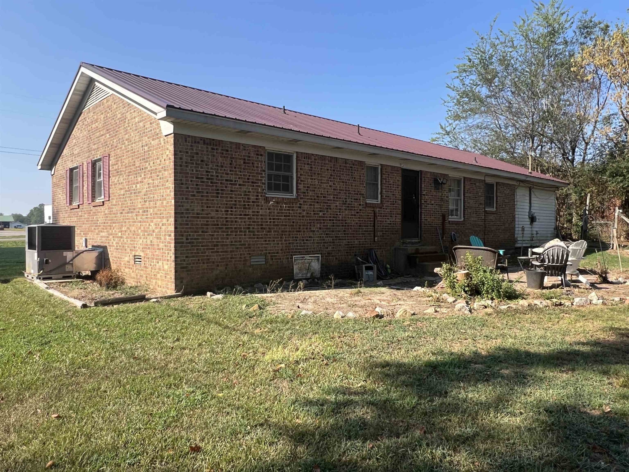 65 Walnut Street Savannah, TN 38372 - Photo 16 of 18 a view of backyard with sitting area