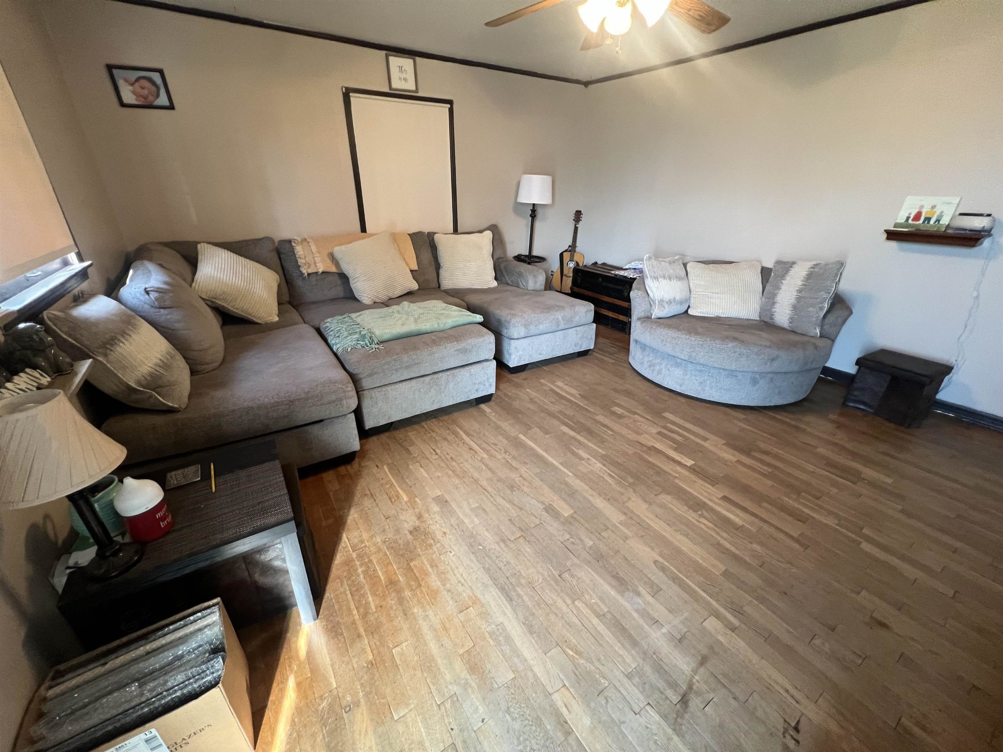 65 Walnut Street Savannah, TN 38372 - Photo 6 of 18 a living room with furniture and a wooden floor