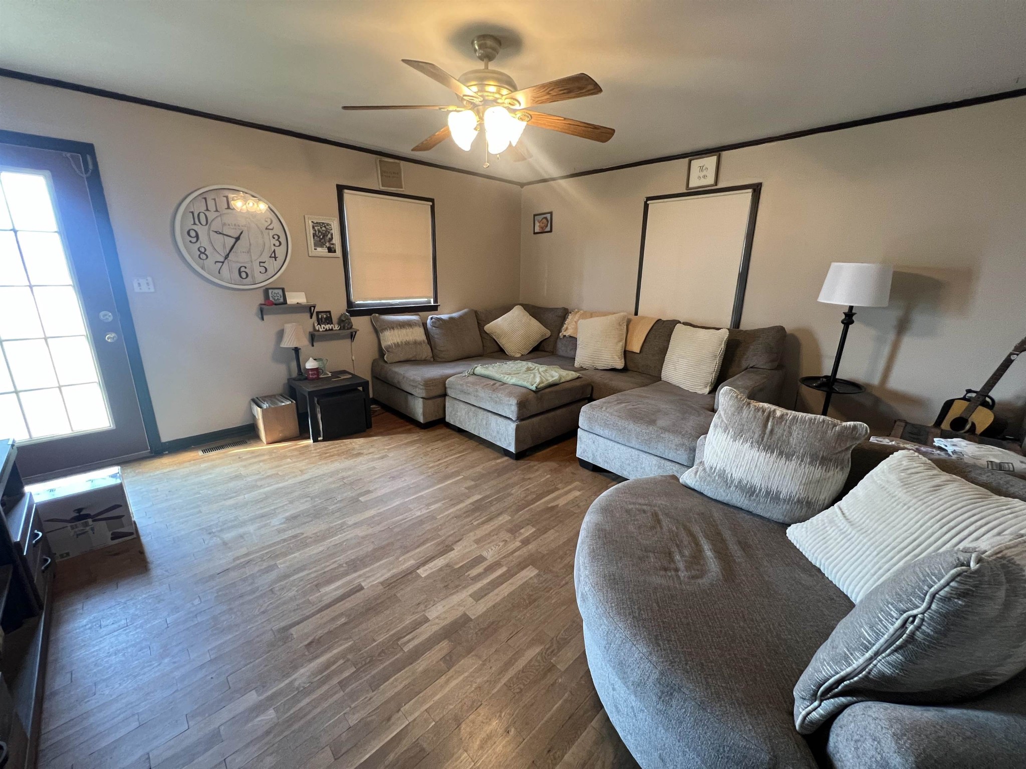 65 Walnut Street Savannah, TN 38372 - Photo 7 of 18 a living room with furniture and a chandelier