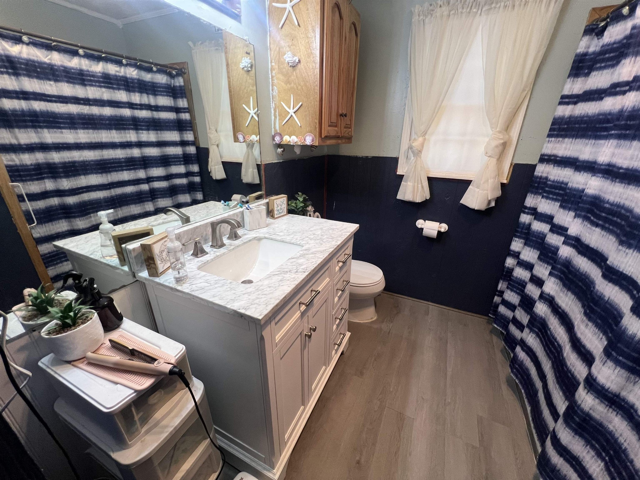 65 Walnut Street Savannah, TN 38372 - Photo 10 of 18 a bathroom with a sink and a mirror