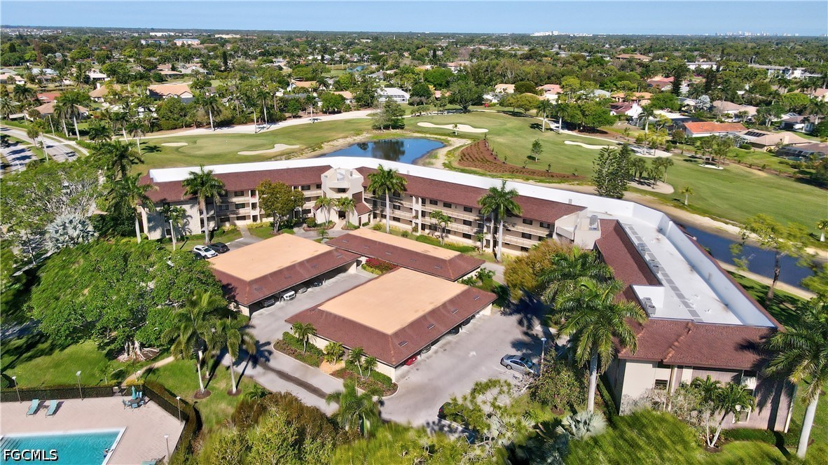 413 Augusta Boulevard, Unit 105 Naples, FL 34113 - Photo 2 of 45 an aerial view of residential houses with outdoor space and river