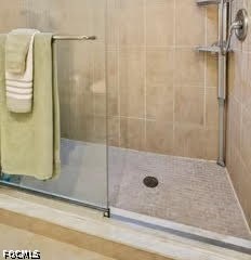 413 Augusta Boulevard, Unit 105 Naples, FL 34113 - Photo 30 of 45 a bathroom with a shower