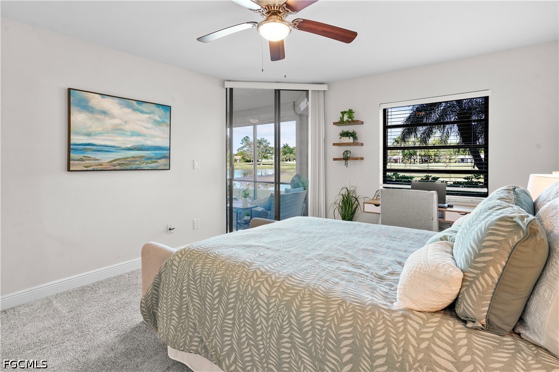 413 Augusta Boulevard, Unit 105 Naples, FL 34113 - Photo 32 of 45 a bedroom with a bed and a chandelier