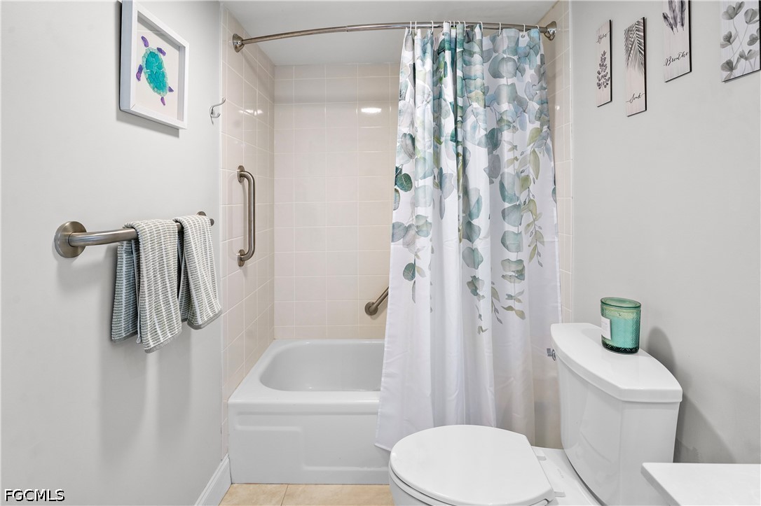 413 Augusta Boulevard, Unit 105 Naples, FL 34113 - Photo 36 of 45 a bathroom with a toilet and a shower