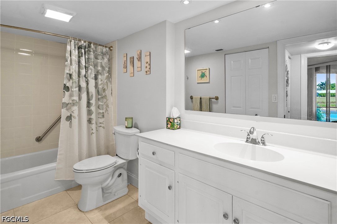 413 Augusta Boulevard, Unit 105 Naples, FL 34113 - Photo 37 of 45 a bathroom with a sink toilet and shower