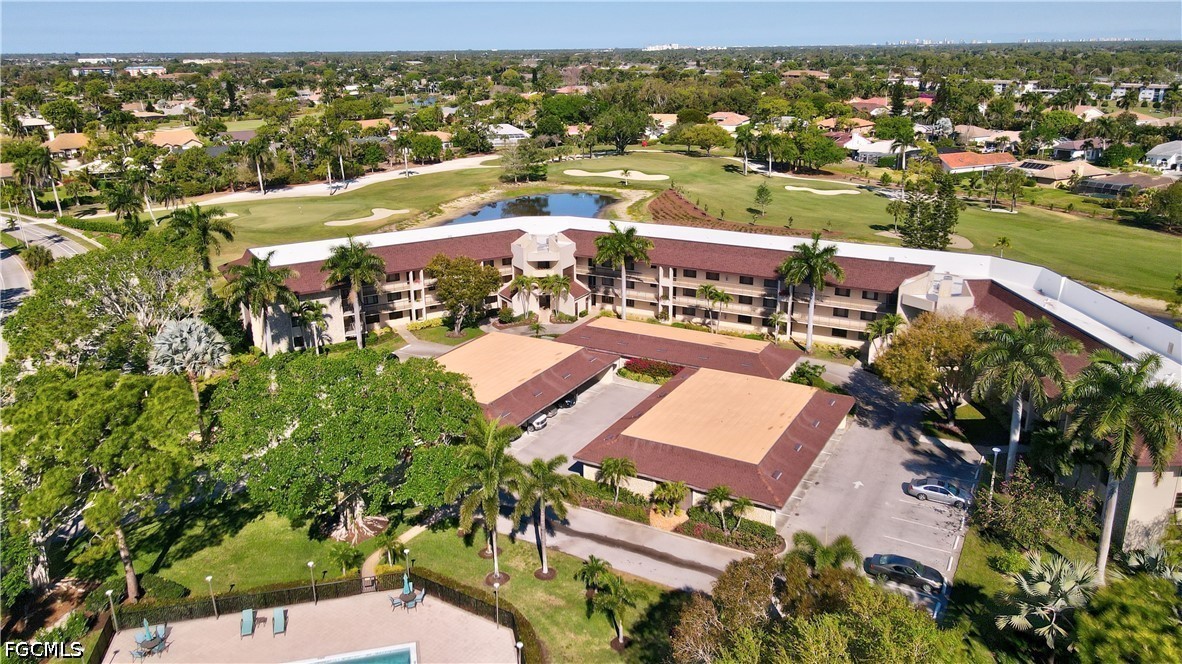413 Augusta Boulevard, Unit 105 Naples, FL 34113 - Photo 4 of 45 an aerial view of residential houses with outdoor space