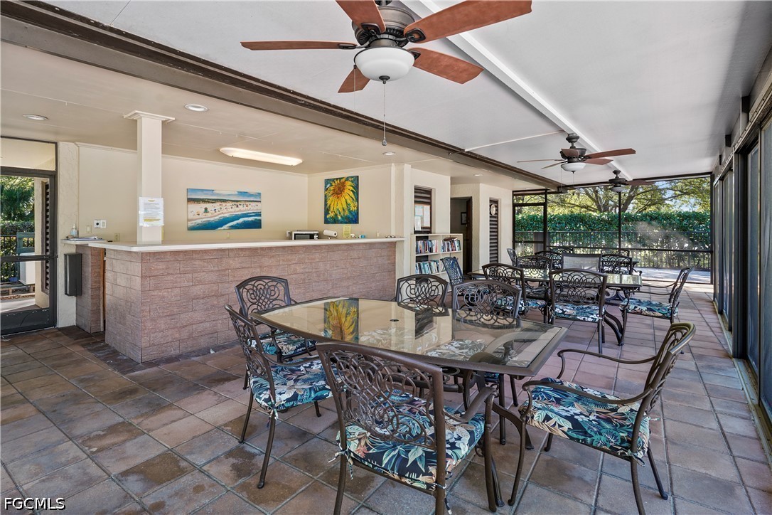 413 Augusta Boulevard, Unit 105 Naples, FL 34113 - Photo 44 of 45 a view of a dining room with furniture window and outside view