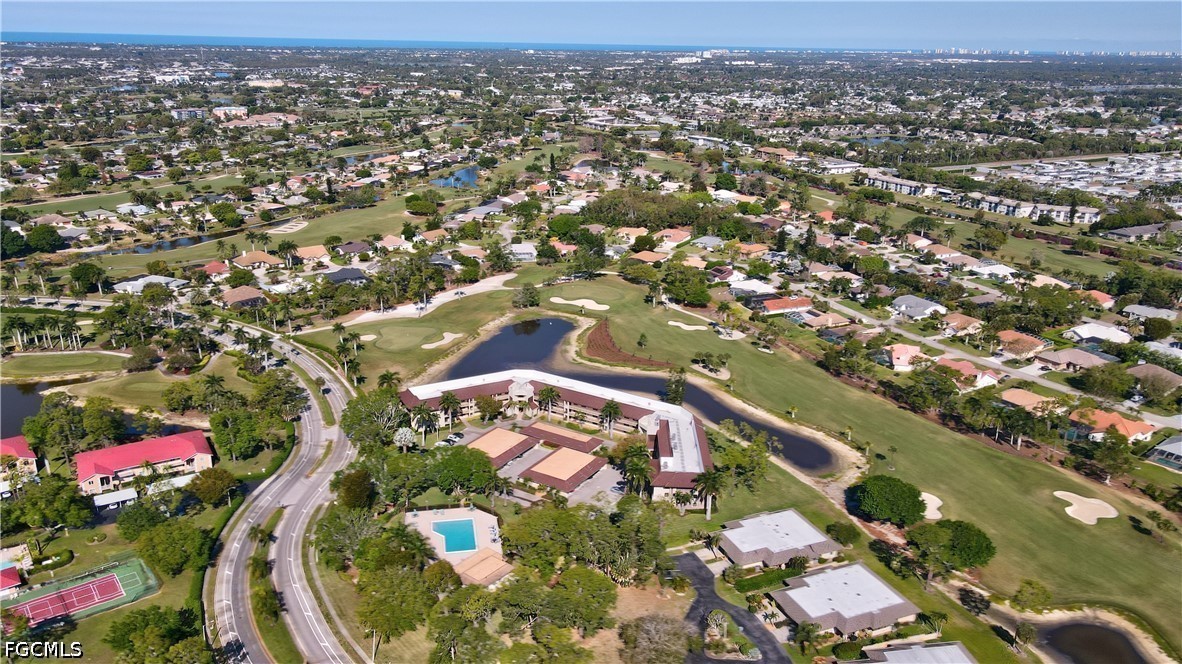 413 Augusta Boulevard, Unit 105 Naples, FL 34113 - Photo 5 of 45 an aerial view of residential houses with outdoor space