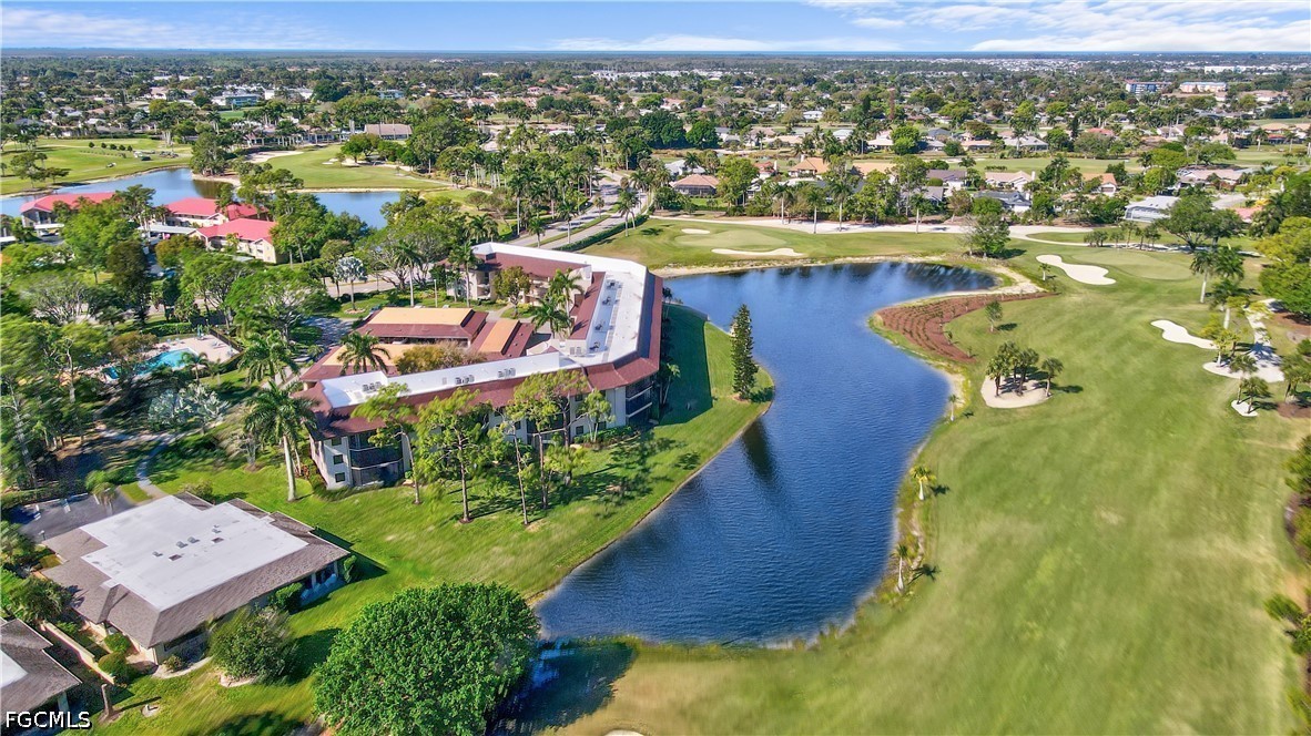 413 Augusta Boulevard, Unit 105 Naples, FL 34113 - Photo 8 of 45 an aerial view of residential houses with outdoor space and pool