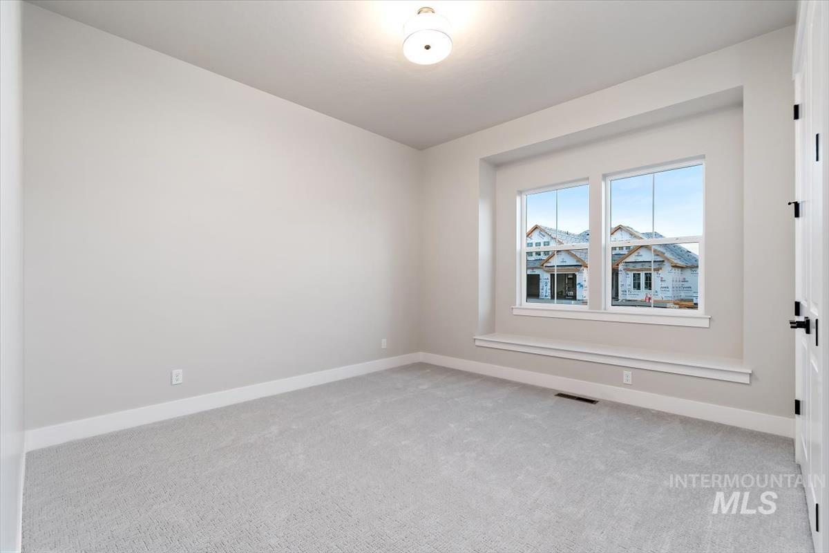 2147 East Blakehurst Avenue Kuna, ID 83634 - Photo 30 of 43 Unfurnished room with light carpet and baseboards