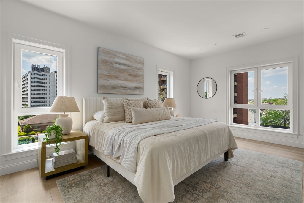 13 Wentworth Road, Unit 404 Quincy, MA 02170 - Photo 9 of 18 a bedroom with bed and a window