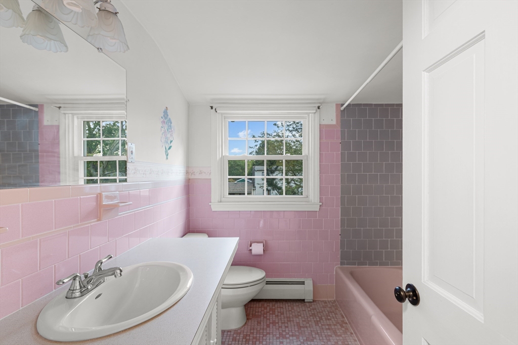 95 Brookside Road Somerset, MA 02726 - Photo 18 of 42 a bathroom with a sink toilet a mirror and tub