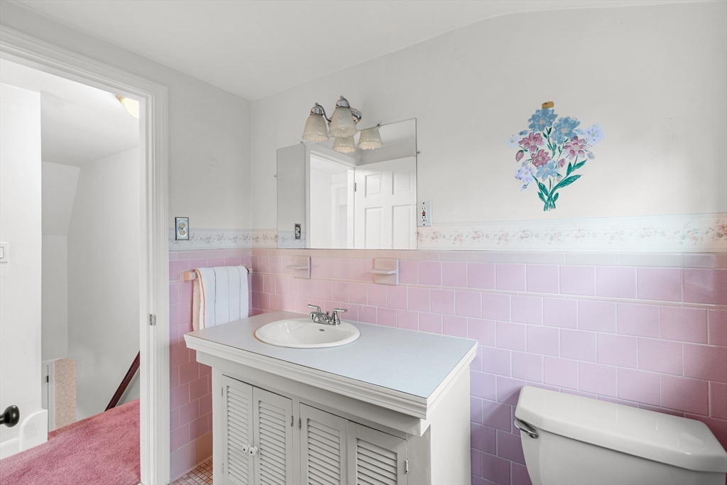 95 Brookside Road Somerset, MA 02726 - Photo 19 of 42 a bathroom with a sink a toilet and a mirror