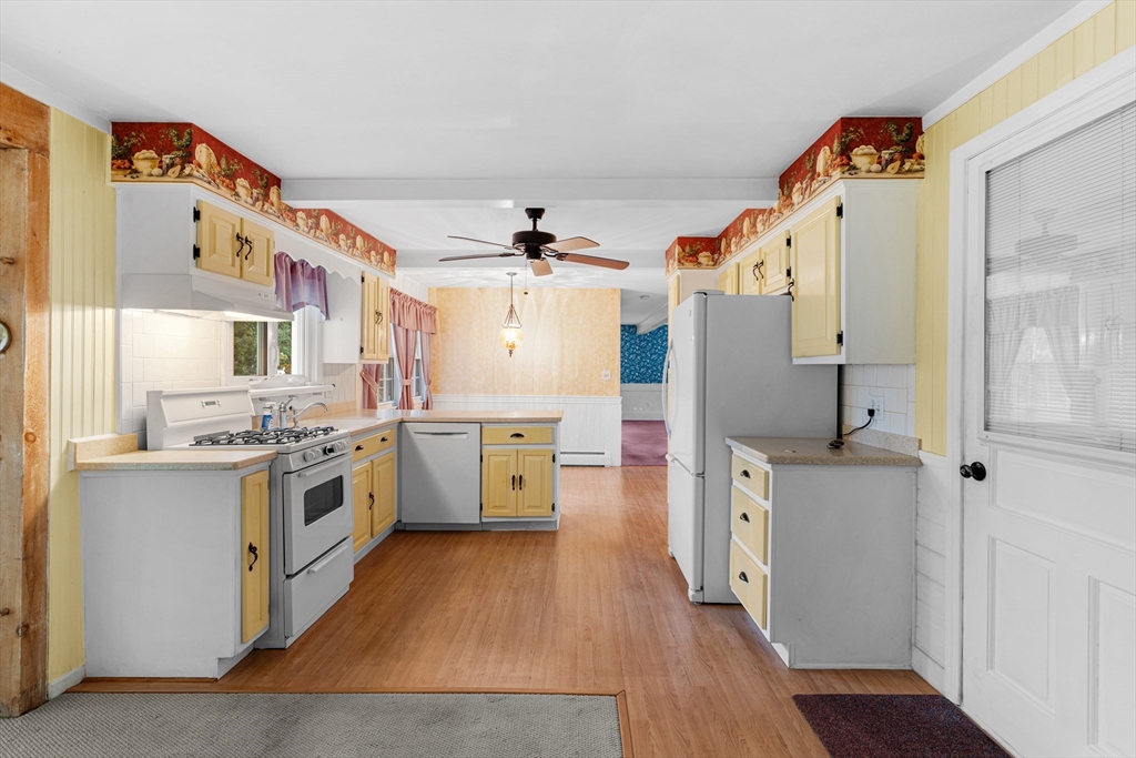 95 Brookside Road Somerset, MA 02726 - Photo 5 of 42 a kitchen with cabinets and wooden floor