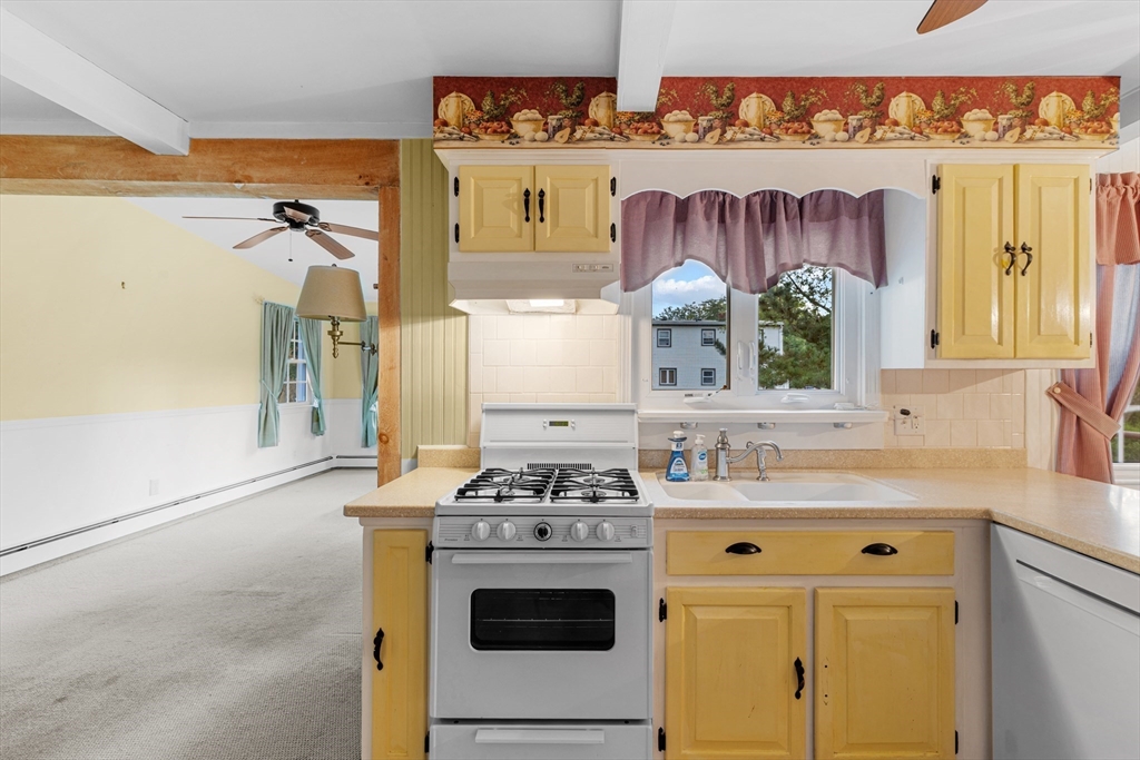 95 Brookside Road Somerset, MA 02726 - Photo 7 of 42 a kitchen with a stove and a sink