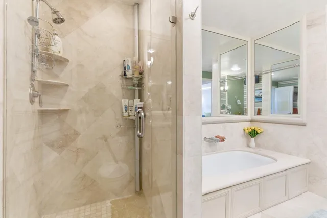 a bathroom with a sink and shower