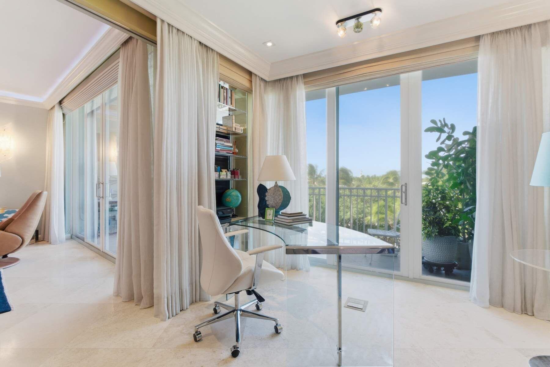 100 Royal Palm Way, Unit F4 Palm Beach, FL 33480 - Photo 20 of 28 a view of a livingroom with furniture and floor to ceiling window