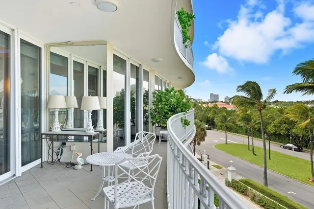 a view of balcony with furniture