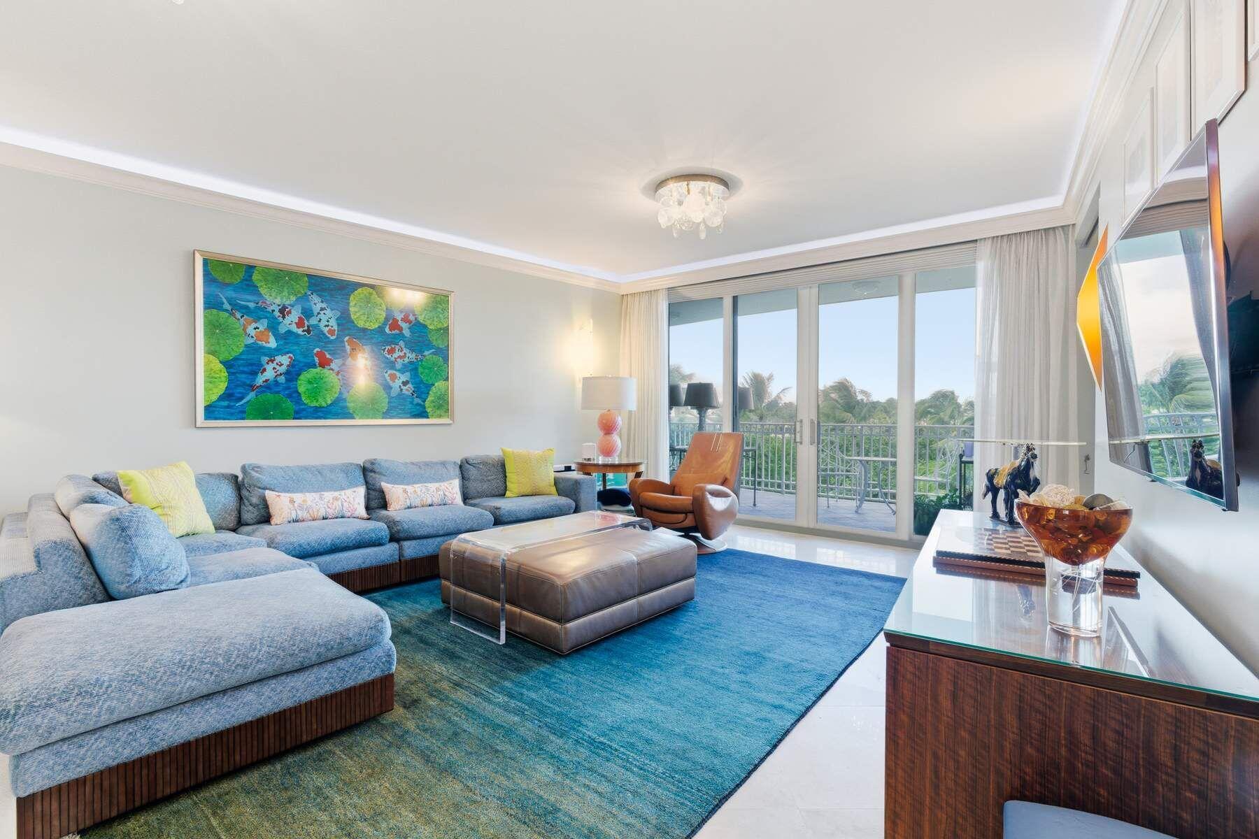 100 Royal Palm Way, Unit F4 Palm Beach, FL 33480 - Photo 6 of 28 a living room with furniture and a large window